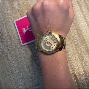 Juicy Couture yellow gold watch with extra links.